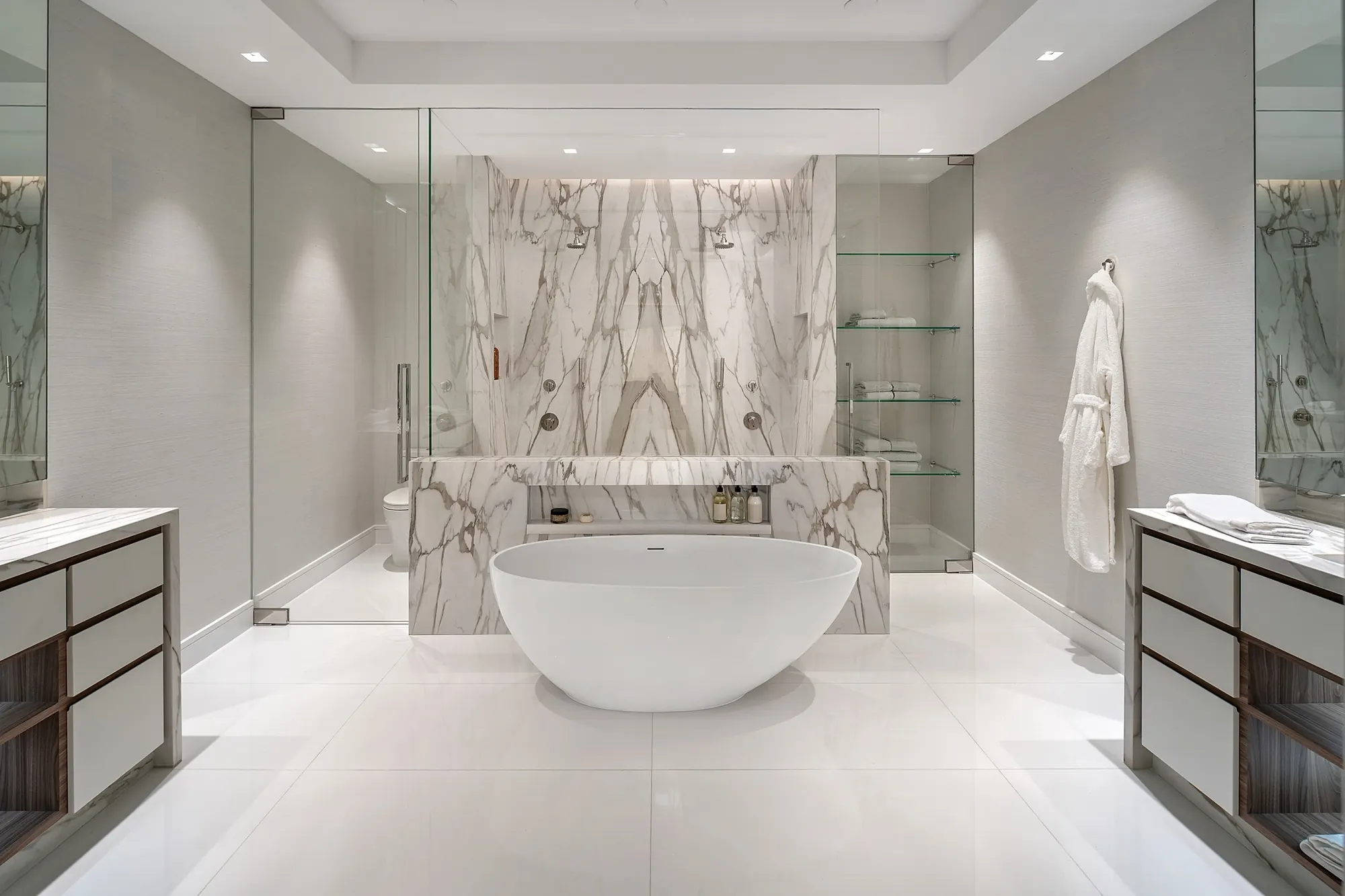 A marble primary bathroom at Boca Beach House