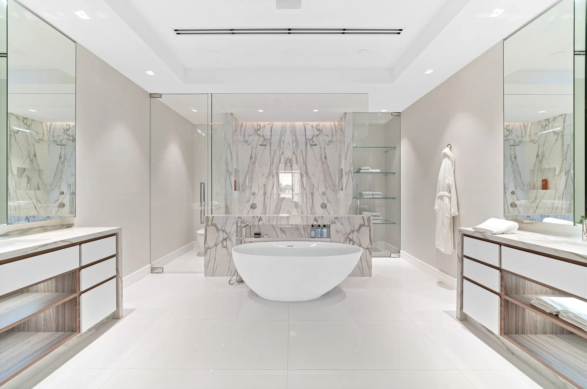 Primary bath with double vanities and mirrored medicine cabinets