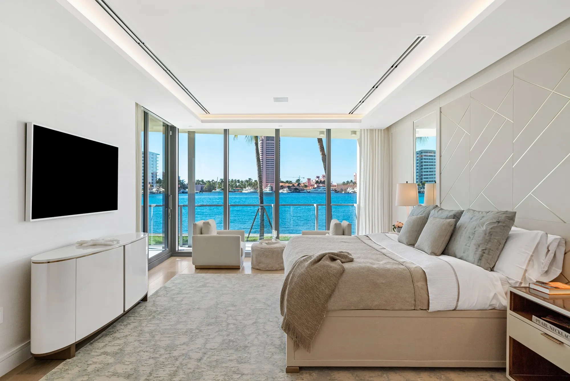 Bedroom with floor-to-ceiling windows to the lake
