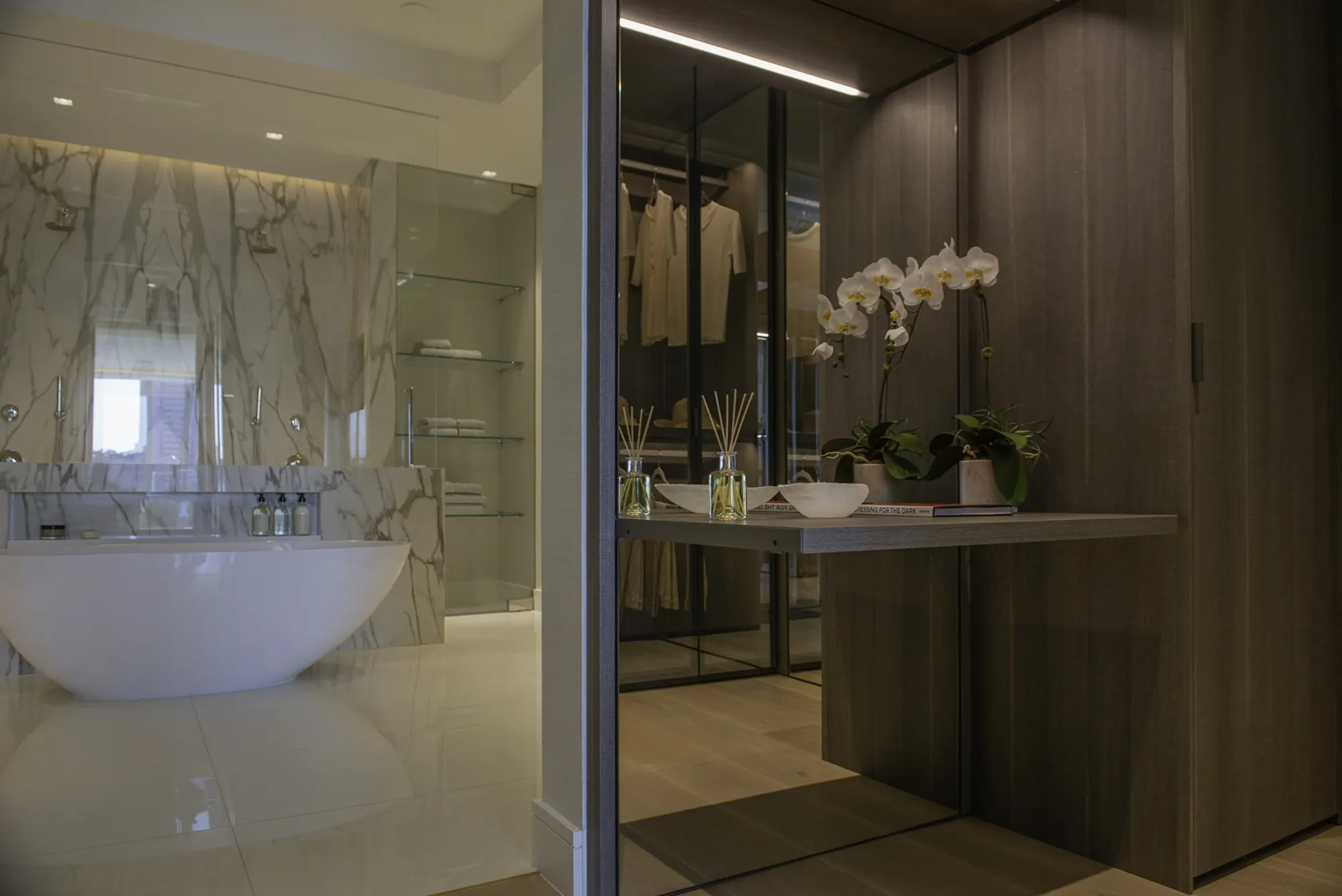 Dressing room opening to the primary bath and soaking tub