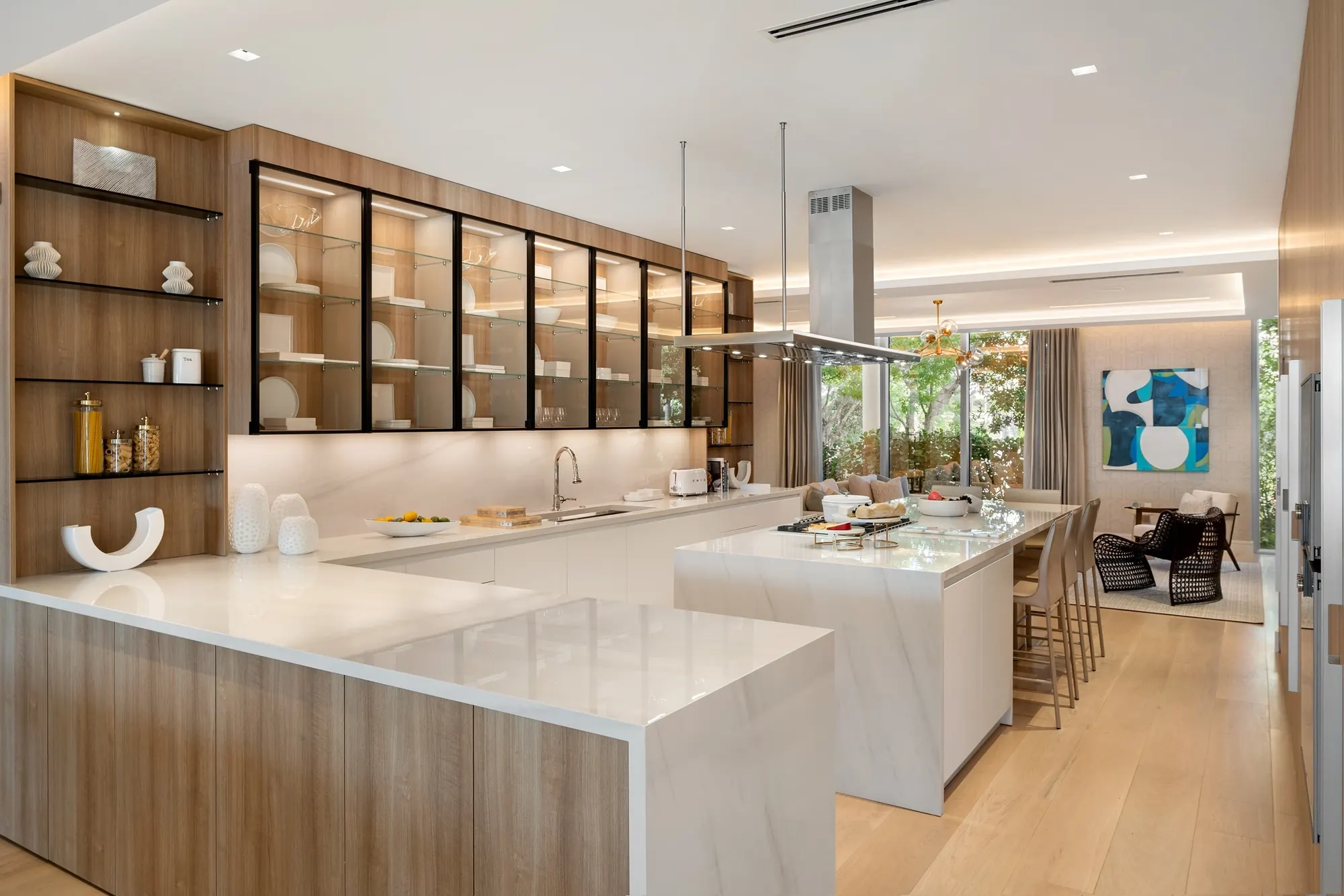 Kitchen with stone counters and glass-front display cabinets