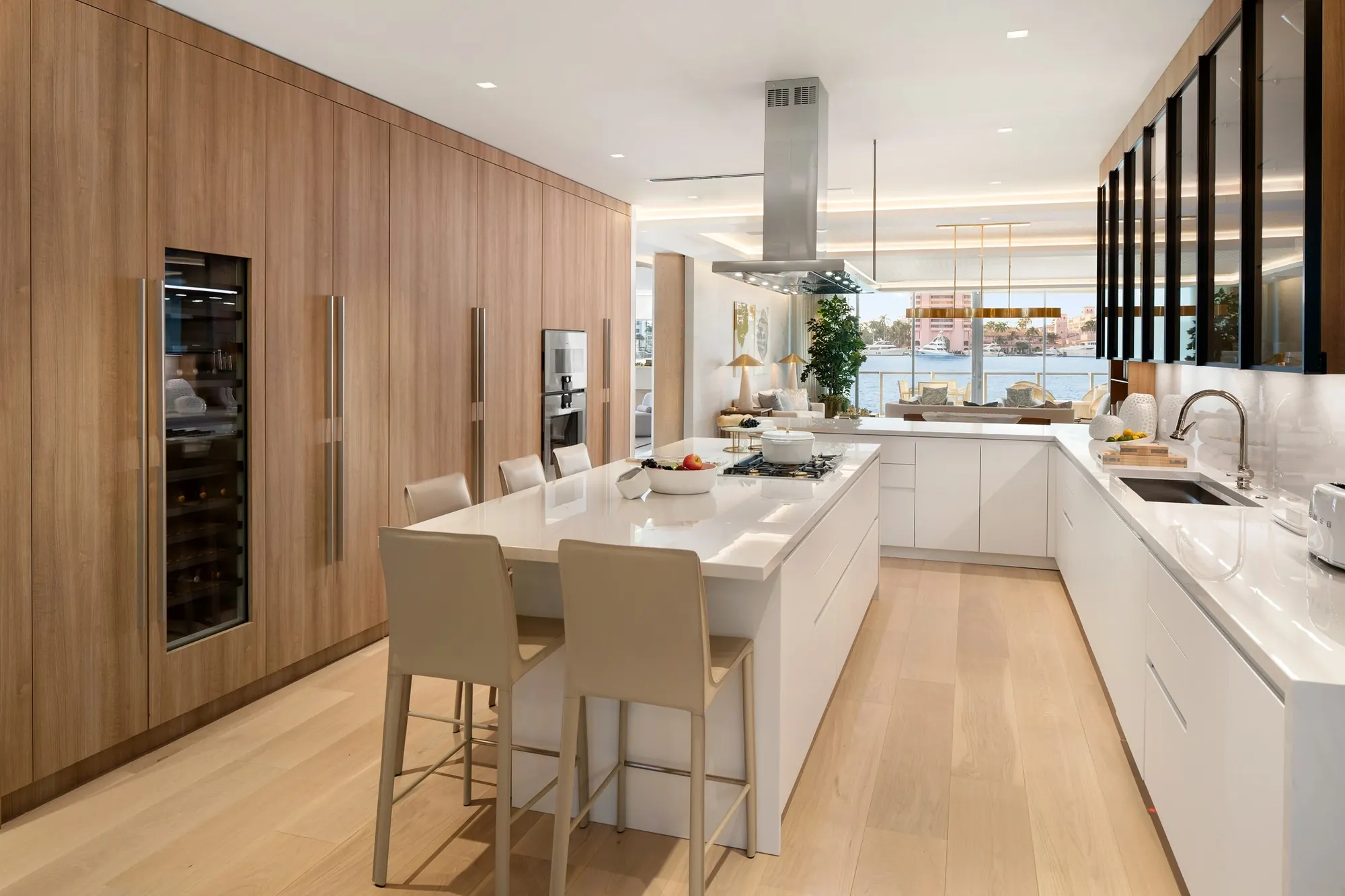Kitchen island with counter seating and tall wood cabinetry