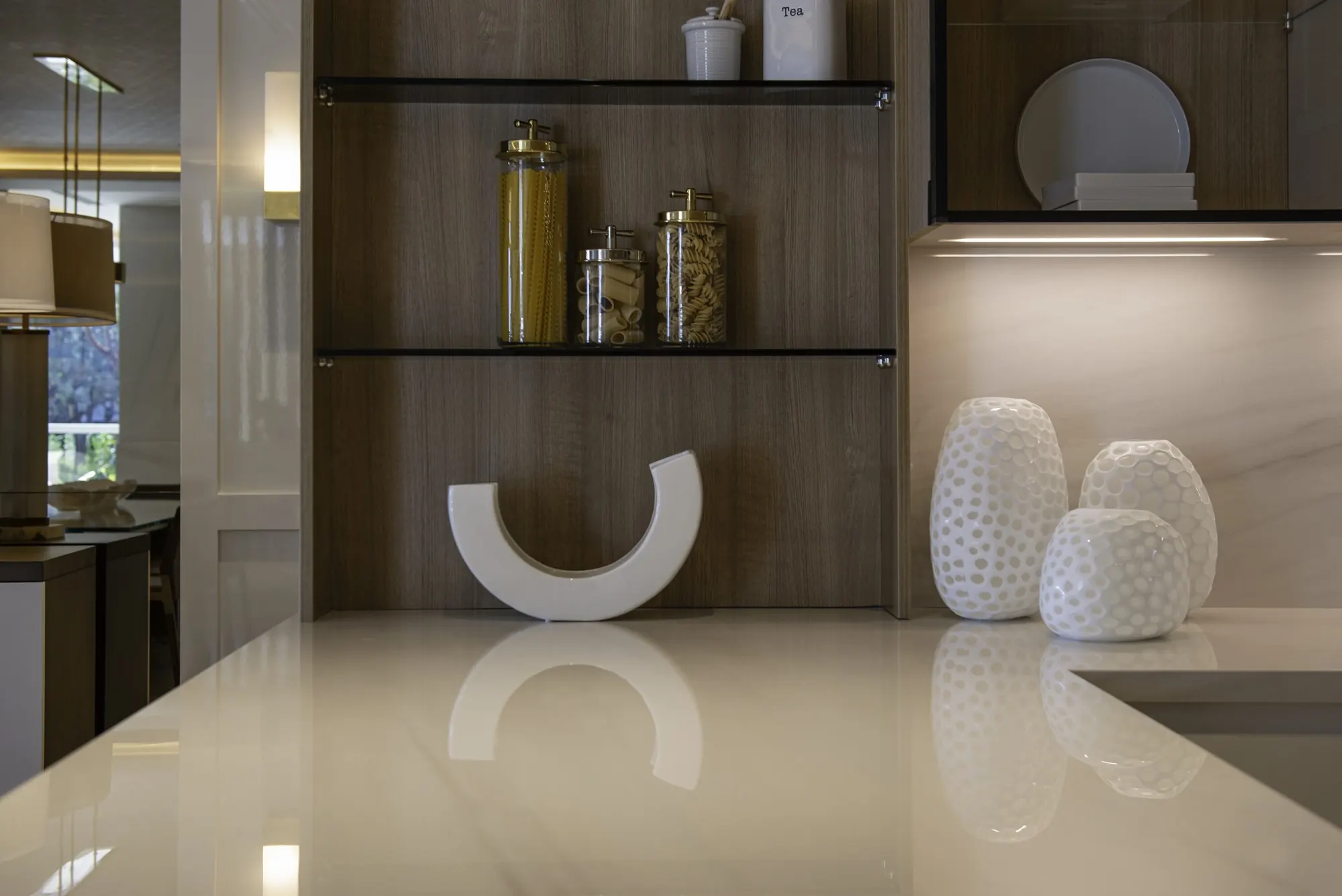 Detail of kitchen shelving and stone surfaces