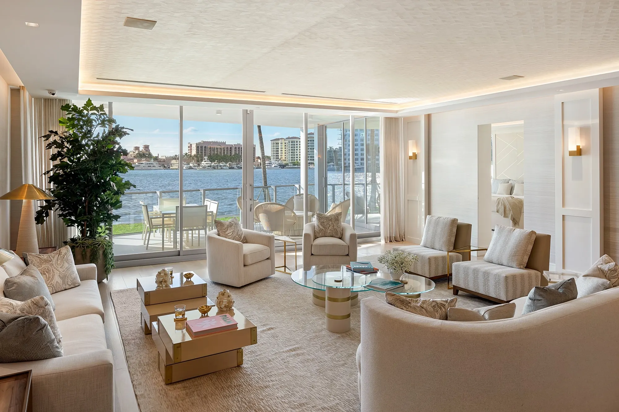 Living room with lake views through floor-to-ceiling glass