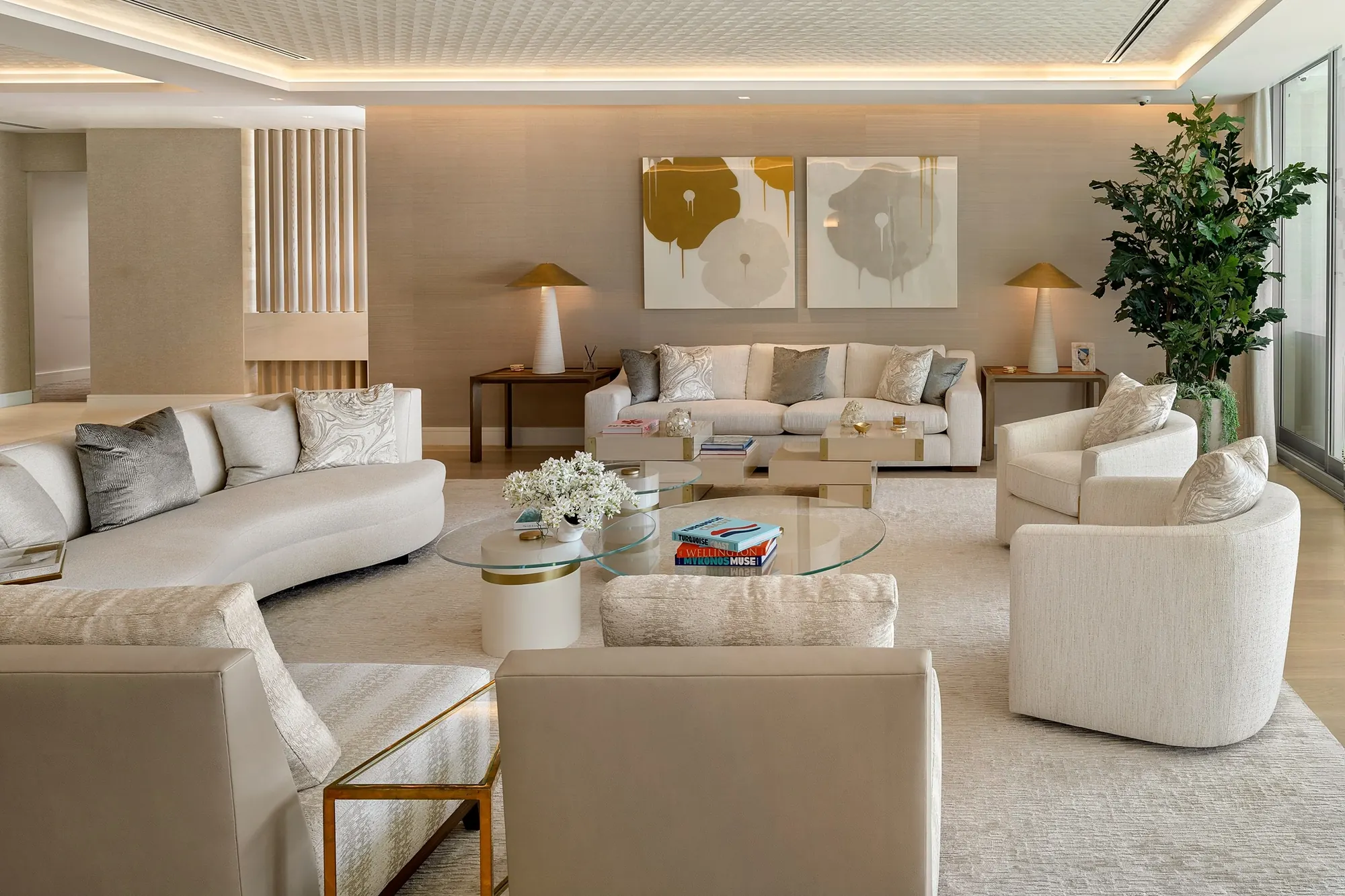 Living room with curved sofa and custom art