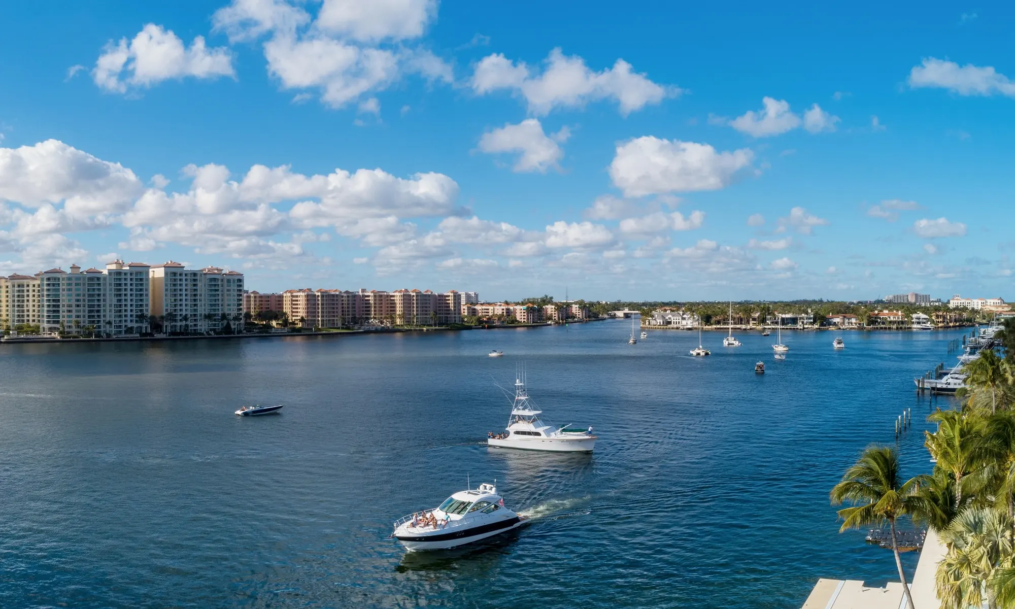 Boats on Lake Boca Raton with the city shoreline beyond