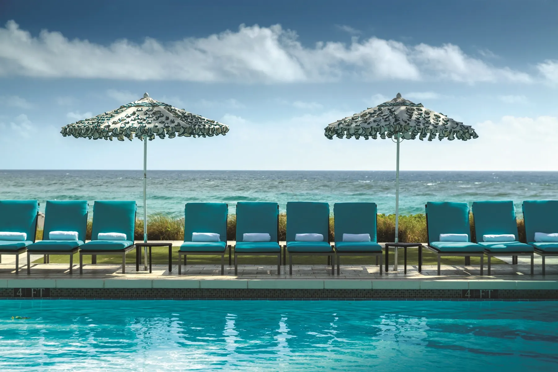 A pool at the Boca Beach Club
